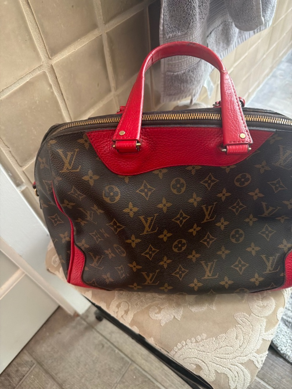 Louis Vuitton estrella Monogram Satchel with matching shoulder crossbidy strap.